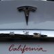 White Tesla Model X rear bumper showing California license plate